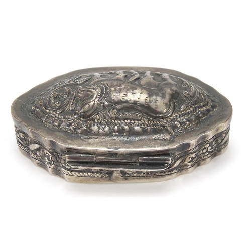 2195 - Indian unmarked silver snuff box, the hinged lid embossed with a mythical animal, 6.5cm wide, 29.2g