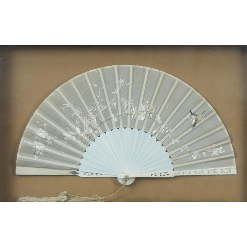 350 - Chinese silk fan with carved ivory sticks, embroidered with a bird amongst flowers, housed in a glaz... 