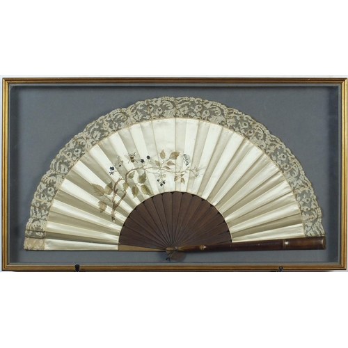 351 - Two Victorian silk fans including an example hand painted with flowers having  bone sticks, each hou... 