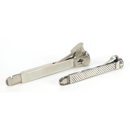 2204 - Two Victorian and later silver cigar cutters, London 1896 and 1978, the largest 15cm in length, tota... 