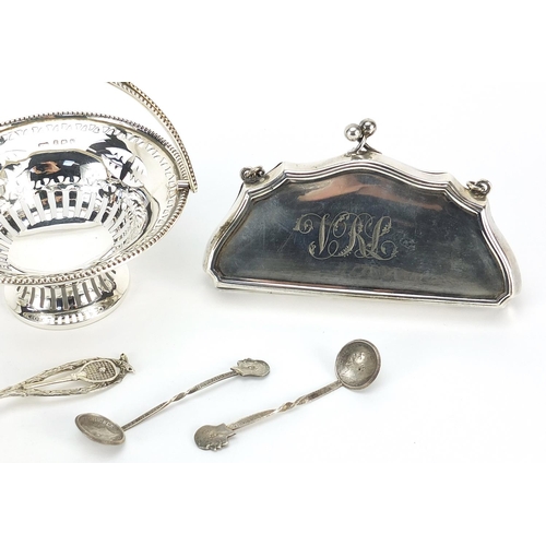 2207 - Silver objects including a concertina purse, pierced bonbon dish with swing handle and tennis medal,... 