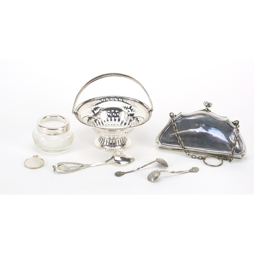 2207 - Silver objects including a concertina purse, pierced bonbon dish with swing handle and tennis medal,... 