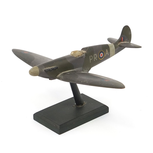 1436 - Military interest hand painted wooden model of a Spitfire, inscribed made by Flight Lieutenant Ralph... 