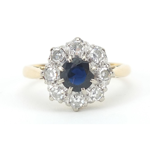 1592 - 18ct gold sapphire and diamond flower head ring, the diamonds approximately 2.5mm in diameter, size ... 