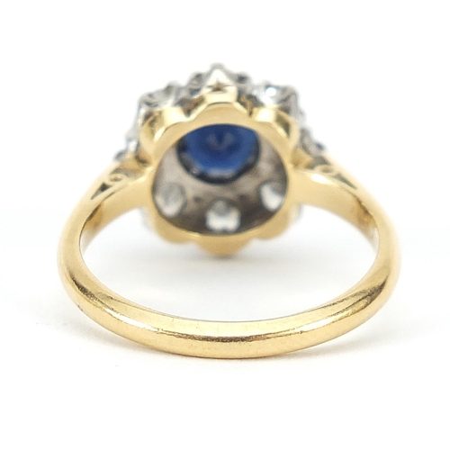 1592 - 18ct gold sapphire and diamond flower head ring, the diamonds approximately 2.5mm in diameter, size ... 