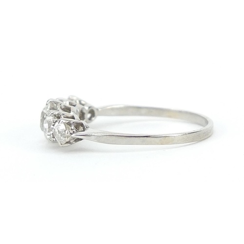 1596 - Unmarked white metal graduated diamond five stone ring, the central diamond approximately 4.5mm in d... 