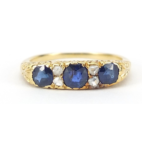 1589 - Unmarked gold sapphire and diamond ring, the central sapphire approximately 4mm in diameter, size O,... 