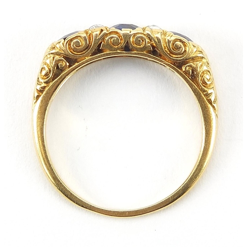 1589 - Unmarked gold sapphire and diamond ring, the central sapphire approximately 4mm in diameter, size O,... 