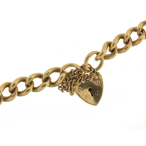 1611 - 9ct gold charm bracelet with love heart padlock, 20cm in length, 26.0g