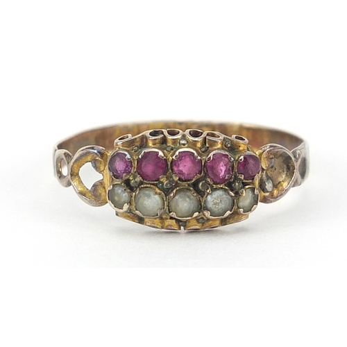 1637 - Antique 12ct gold pink stone and seed pearl ring with ornate setting, size O, 1.2g