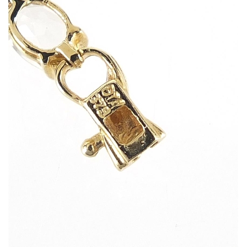 1641 - 9ct gold aquamarine and diamond bracelet, 18cm in length, 5.8g