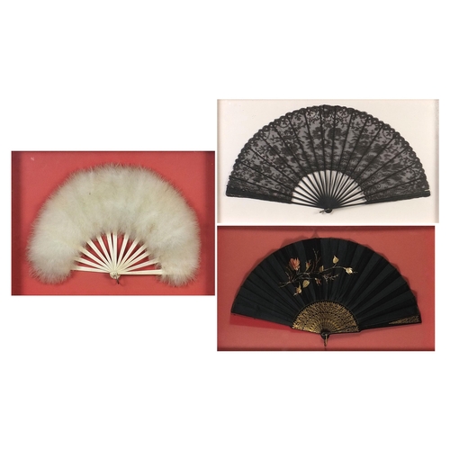 352 - Three Victorian fans comprising two mourning examples and one with bone sticks, each housed in a gla... 