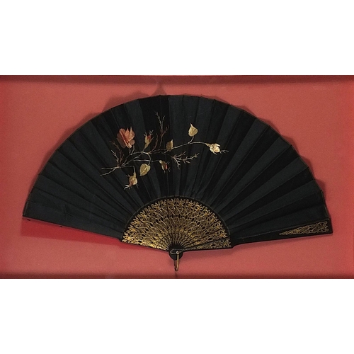 352 - Three Victorian fans comprising two mourning examples and one with bone sticks, each housed in a gla... 