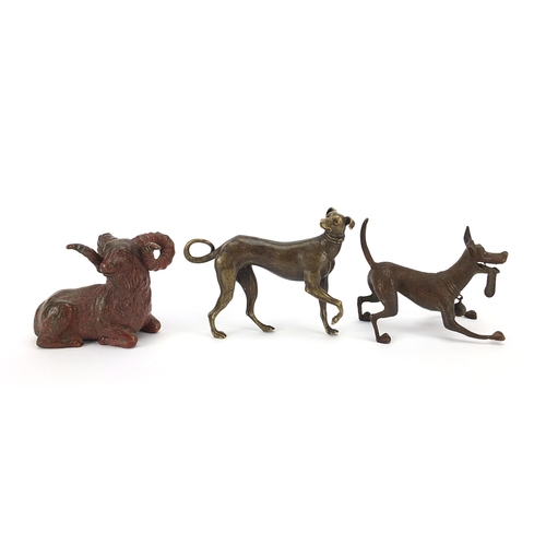 307 - Two Japanese patinated bronze animals comprising goat and dog, together with one other dog, the two ... 