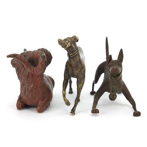 307 - Two Japanese patinated bronze animals comprising goat and dog, together with one other dog, the two ... 