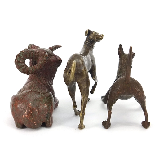 307 - Two Japanese patinated bronze animals comprising goat and dog, together with one other dog, the two ... 