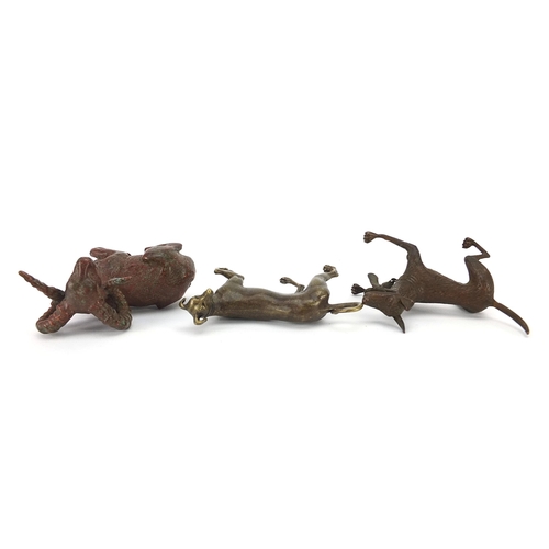 307 - Two Japanese patinated bronze animals comprising goat and dog, together with one other dog, the two ... 