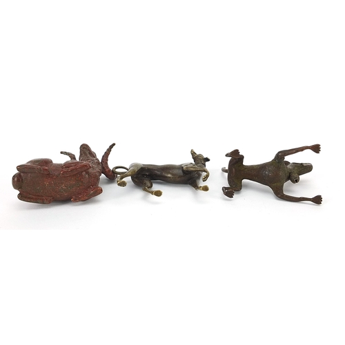 307 - Two Japanese patinated bronze animals comprising goat and dog, together with one other dog, the two ... 