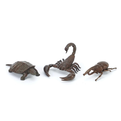 306 - Three Japanese patinated bronze animals comprising scorpion, tortoise and Hercules beetle, each with... 