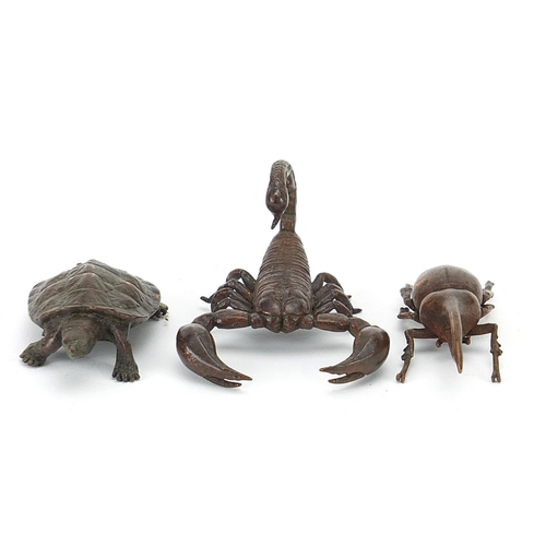 306 - Three Japanese patinated bronze animals comprising scorpion, tortoise and Hercules beetle, each with... 