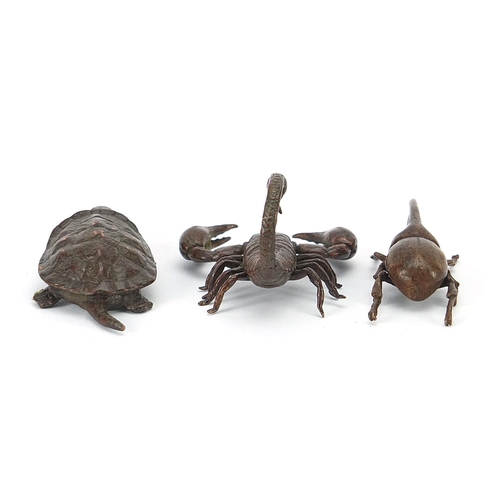 306 - Three Japanese patinated bronze animals comprising scorpion, tortoise and Hercules beetle, each with... 