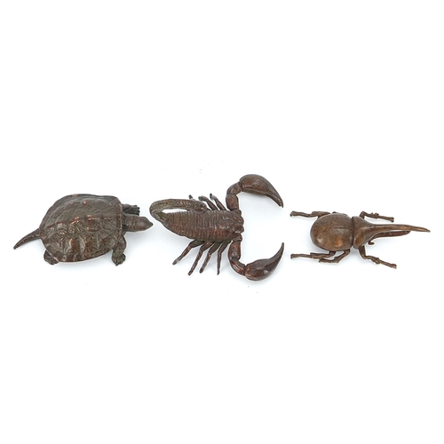 306 - Three Japanese patinated bronze animals comprising scorpion, tortoise and Hercules beetle, each with... 