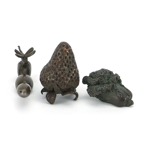 127 - Three Japanese patinated bronze vegetables and fruits, each with impressed marks, the largest 8cm in... 