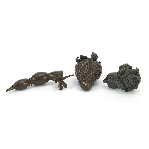 127 - Three Japanese patinated bronze vegetables and fruits, each with impressed marks, the largest 8cm in... 