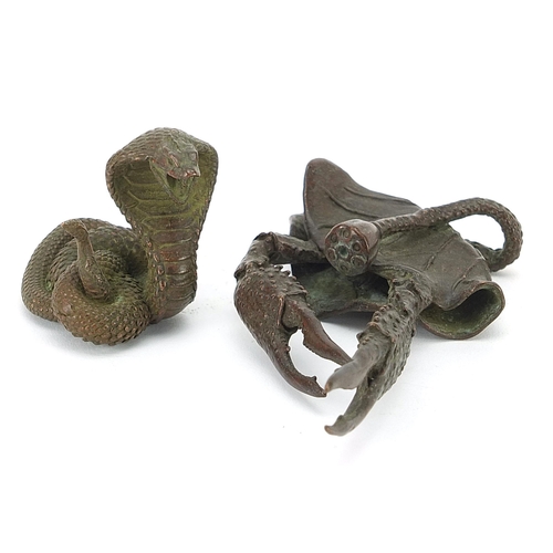 308 - Two Japanese patinated bronze animals comprising cobra and crab, the largest 10.5cm in length