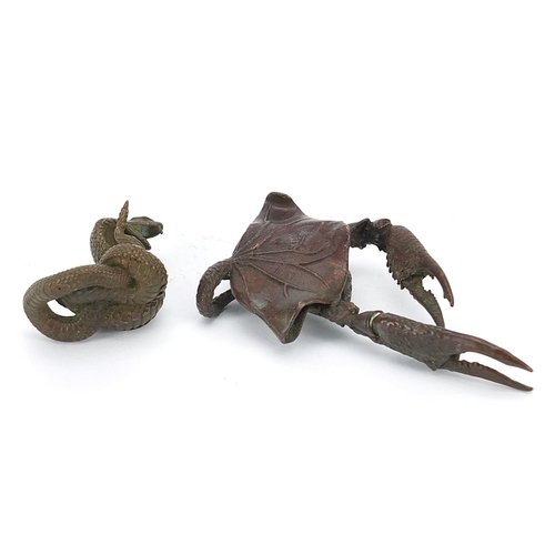 308 - Two Japanese patinated bronze animals comprising cobra and crab, the largest 10.5cm in length