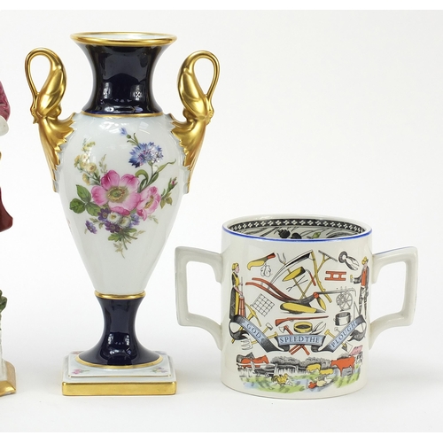 1389 - Collectables comprising a God speed the plough handled mug, Kaiser porcelain twin swan handled vase,... 