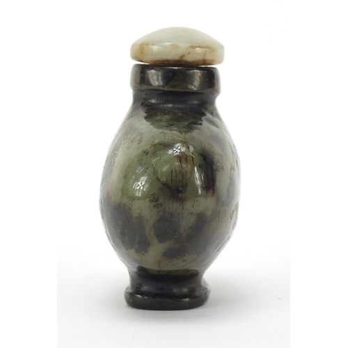 303 - Chinese jade snuff bottle carved with a dragon in a mountainous landscape and calligraphy, 6cm high