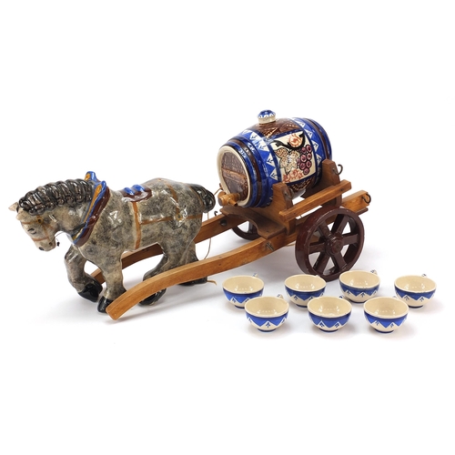 258 - Quimper pottery comprising a horse and cart and seven cups, the largest 51cm in length
