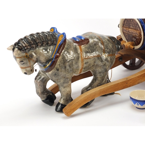 258 - Quimper pottery comprising a horse and cart and seven cups, the largest 51cm in length