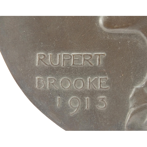 239 - Circular bronze plaque with bust of Rupert Brooke dated 1913, 21.5cm in diameter