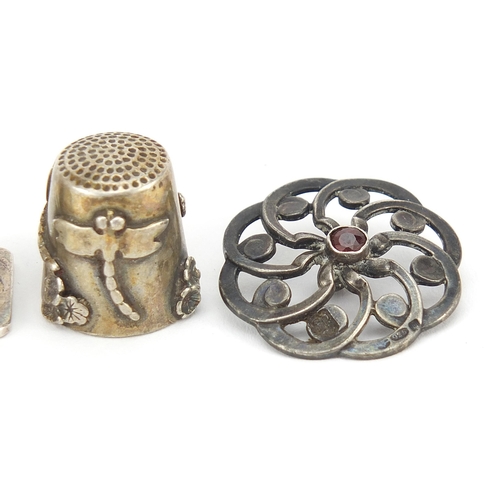 2189 - Silver objects  comprising a pair of Victorian design garnet buttons, desk seal and dragonfly thimbl... 