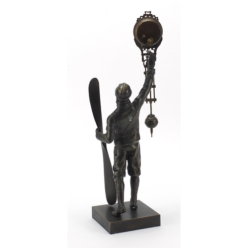 1438 - Patinated bronze military interest mystery clock in the form of a pilot, 37cm high