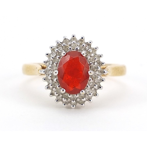 1618 - 18ct gold orange stone and diamond cluster ring, possibly fire opal, size P, 5.0g