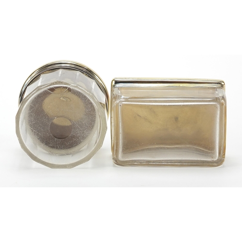 2224 - Asprey, two cut glass jars with silver gilt lids and engine turned decoration, the largest 9cm wide