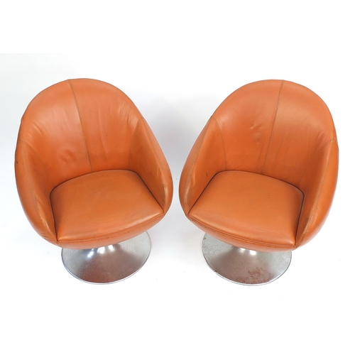 1451 - Pair of vintage egg type tub chairs, signs of paper labels to the underside, each 78cm high