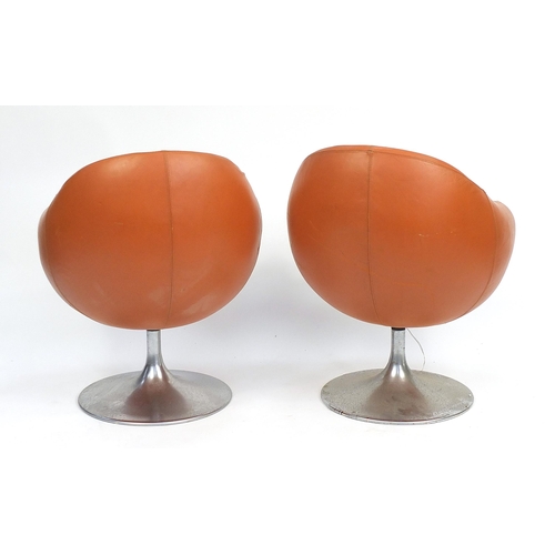 1451 - Pair of vintage egg type tub chairs, signs of paper labels to the underside, each 78cm high