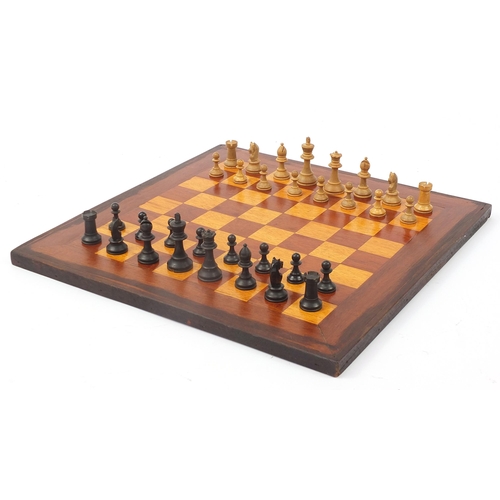 362 - Mahogany and boxwood inlaid chess board and a Staunton pattern chess set