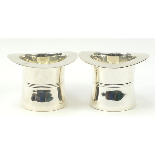 416 - Pair of silver plated Champagne ice buckets in the form of top hats, 18cm high x 24cm in diameter