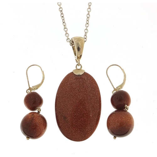 1390 - Silver goldstone pendant on a silver necklace with matching earrings, the pendant 5.5cm high, total ... 