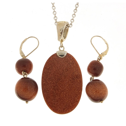 1390 - Silver goldstone pendant on a silver necklace with matching earrings, the pendant 5.5cm high, total ... 