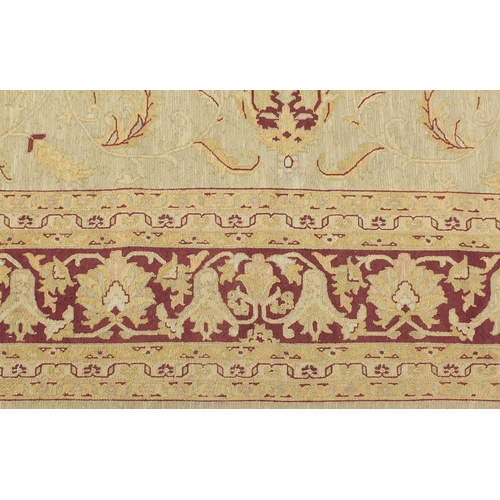 1457 - Large Indian hand woven beige ground rug, 532cm x 350cm