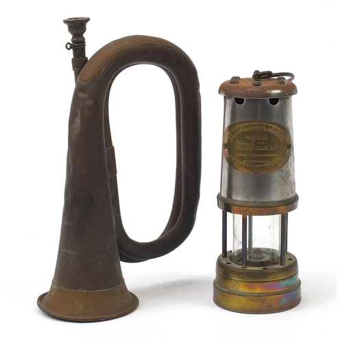 1388 - Copper bugle by A F Matthews of London dated 1949 and a British coal miner's lamp with brass plate t... 