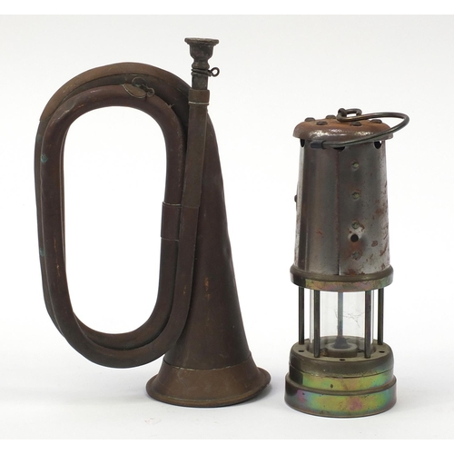 1388 - Copper bugle by A F Matthews of London dated 1949 and a British coal miner's lamp with brass plate t... 