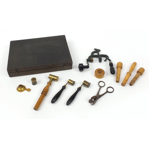 102 - Antique gun ammunition making equipment including a cartridge maker, clamps and scissors housed in a... 