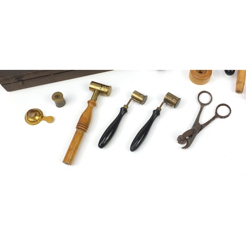 102 - Antique gun ammunition making equipment including a cartridge maker, clamps and scissors housed in a... 